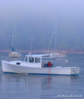 View of  Maine lobster boats in misty Bar Harbor, Maine waters